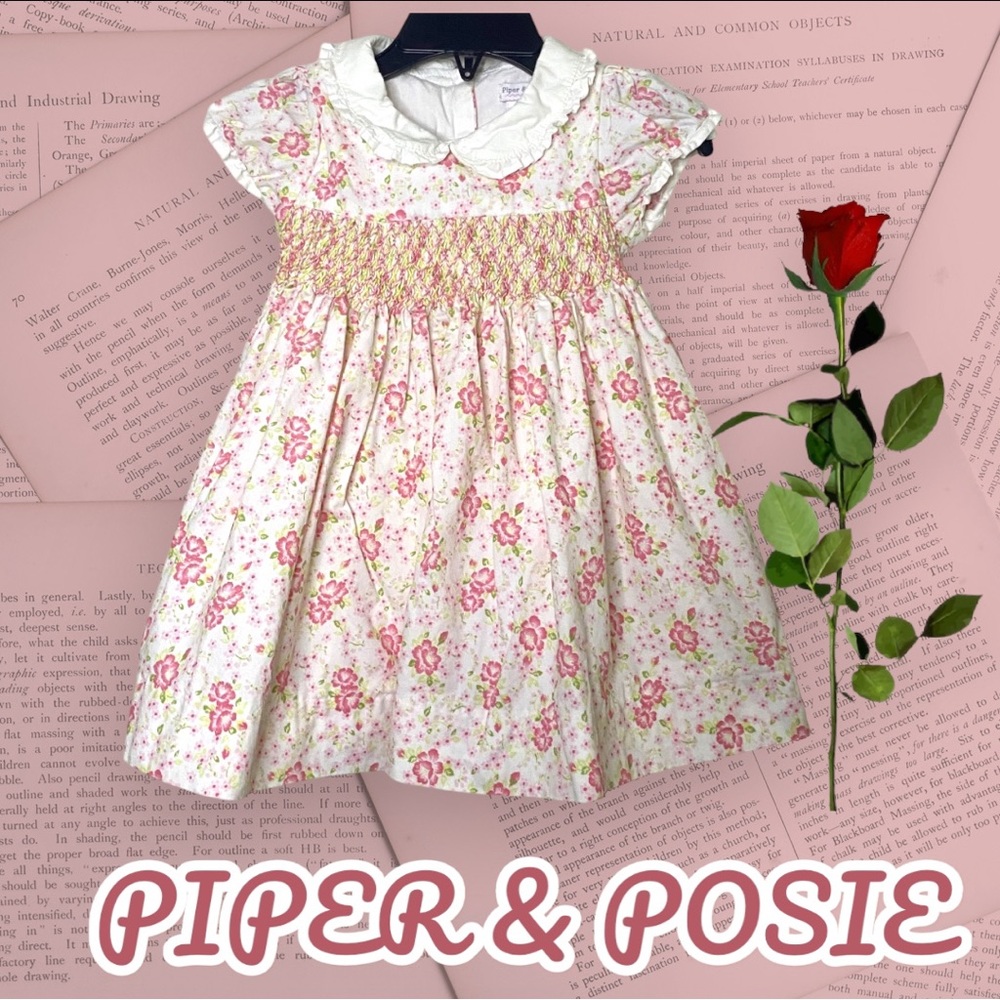 Sweet as roses!! This little girls dress is 100% cotton. Size 12 months.